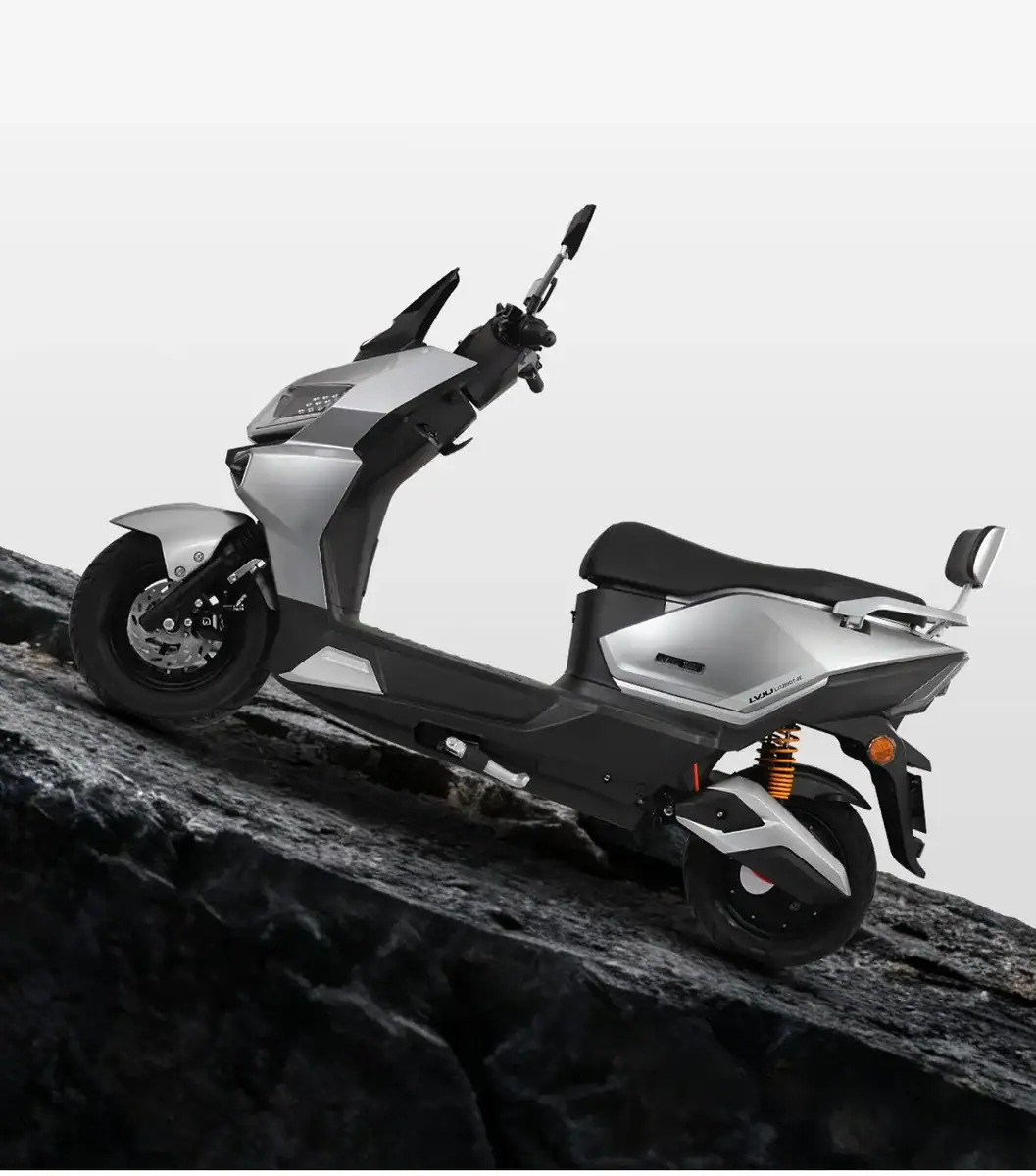 Electric scooter on rocky terrain with a sleek, modern design, suitable for city commuting and eco-friendly transportation.