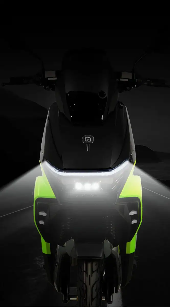 Modern electric scooter with sleek black and neon green design, featuring bright LED headlights and aerodynamic build, ideal for urban commuting and eco-friendly transportation.