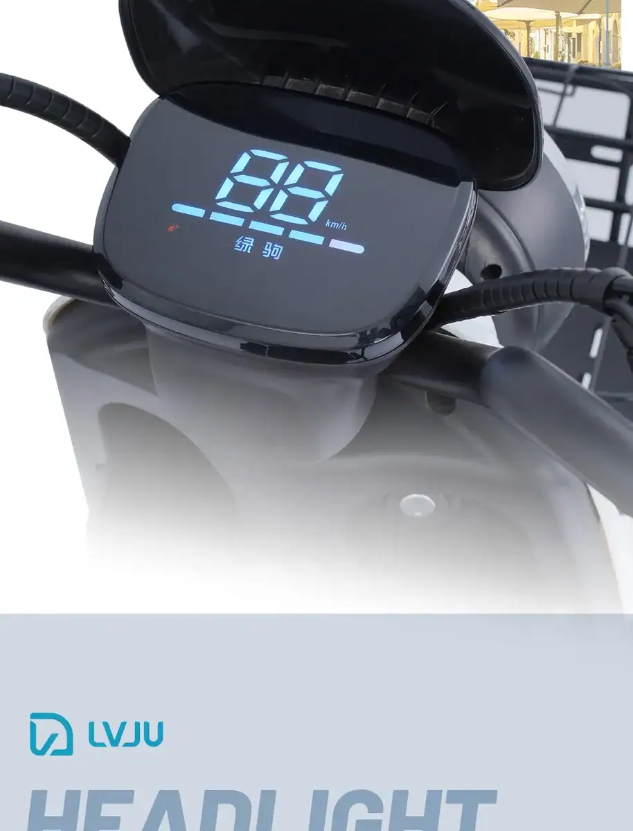 Electric scooter dashboard with digital speedometer and battery indicator.